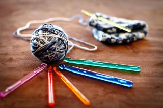 Picture of a ball of yarn and four crochet hooks